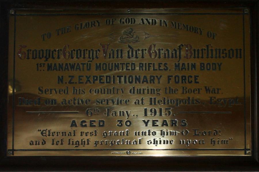 Detailed view of brass plaque with inscribed text about the service of Trooper George Van der Graaf Burlinson