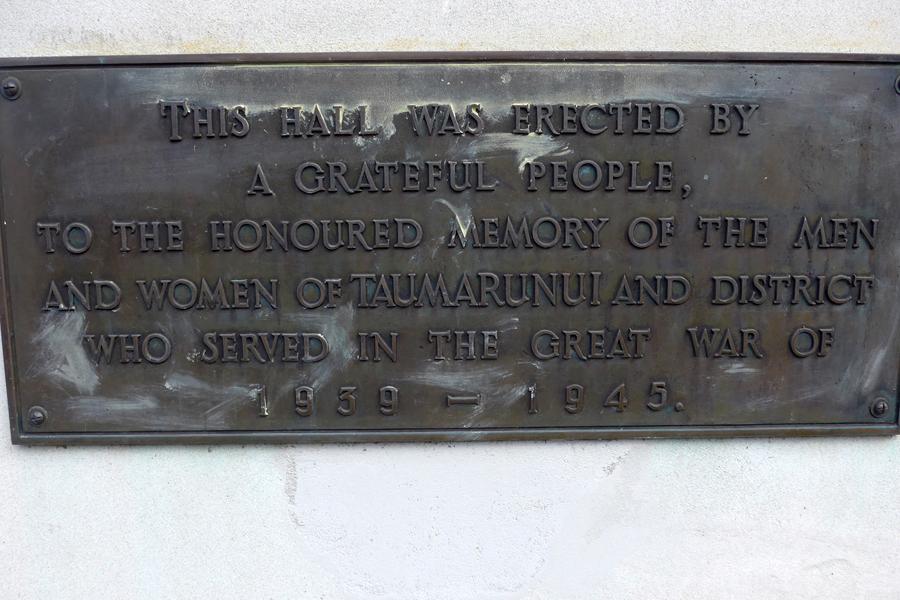 Granite foundaton stone near entrance to hall with illegible inscription: THIS FOUNDATION STONE WAS LAID BY / HIS EXCELLENCY LIEUTENANT-GENERAL / SIR C. WILLOUGHBY NORRIE / GCMG, GCVO, CB, DSO, MC / ON THE 18TH FEBRUARY 1957.