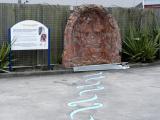 Waimapihi Stream artwork made from historic brick culvert next to information panel with text and historic photographs