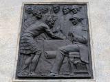 Detail of bronze relief on Queen Victoria statue showing Māori and European figures signing document