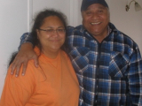 Woman with older man with arm around her shoulder