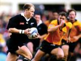 Jeff Wilson runs with the ball against the Wallabies