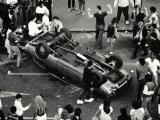 Concertgoers overturn a car during the Queen St riot, 1984