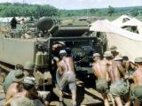 New Zealand gunners loading L5 Howitzer into APC