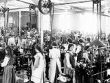 Women workers stand at machines in the Roslyn Woollen Mills, Otago, in 1907