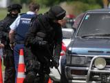 Armed police search a vehicle near Rūātoki
