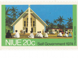 Niue 20c stamp with image of people seated in front of church and the words 'Village meeting' and 'Self Government 1974"