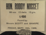 Sign over nugget declares Hon Roddy Nugget 99ozs, 12 dwts, 12 grs. Worth 400 pounds