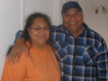 Woman with older man with arm around her shoulder