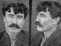 Mugshots of man with dark hair and moustache