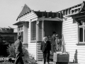 Walter Nash visits a tornado-damaged house in Frankton