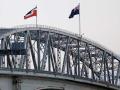 Tino Rangatiratanga flag flying on Auckland Harbour Bridge