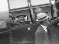 Men sitting in old aircraft on land