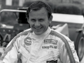 A smiling Bruce McLaren in his racing overalls