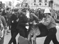 Police leading away an anti-Vietnam War protester, 1971