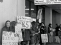 Women demonstrate outside a Social Welfare office, 1977