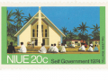 Niue 20c stamp with image of people seated in front of church and the words 'Village meeting' and 'Self Government 1974"