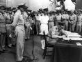 Isitt signing the Japanese surrender treaty on board the USS Missouri