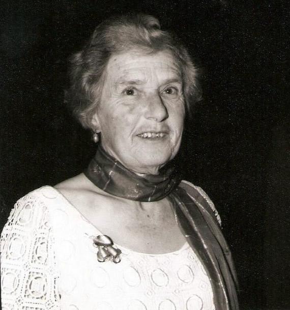 Black and white photo of middle-aged woman with a scarf