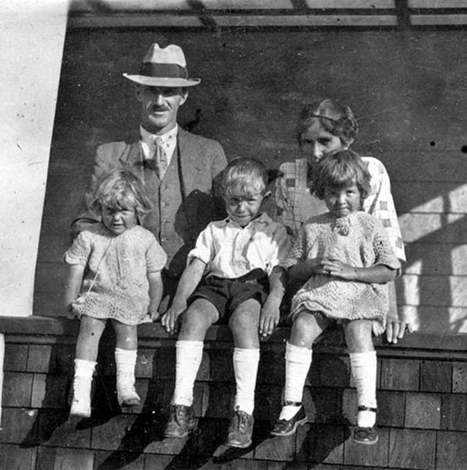 Family group with three young children