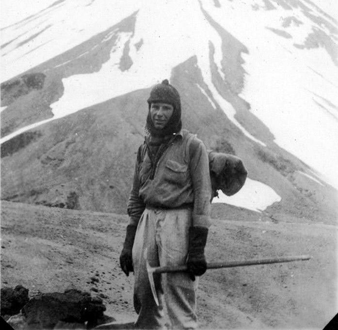 Man dressed in climbing gear on a mountain