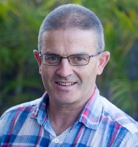Man in glasses wearing check shirt