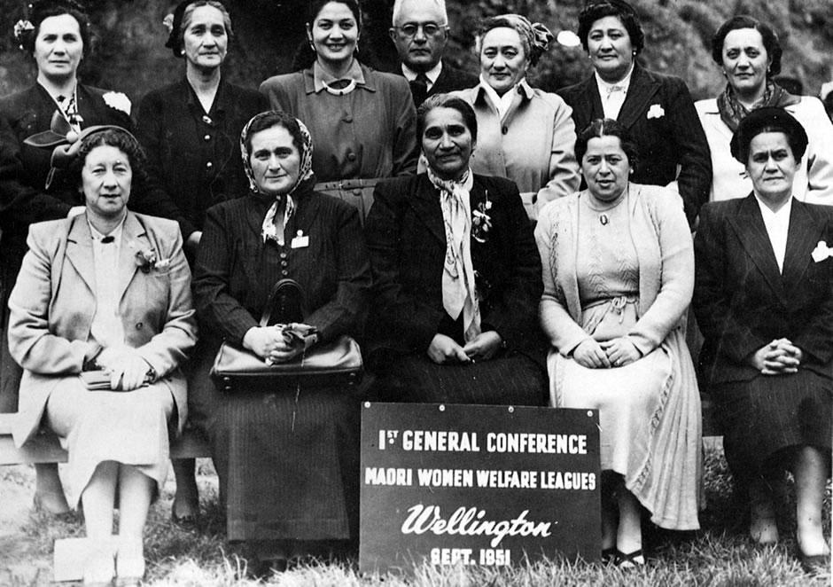 Māori women in various formal dress sitting and standing 