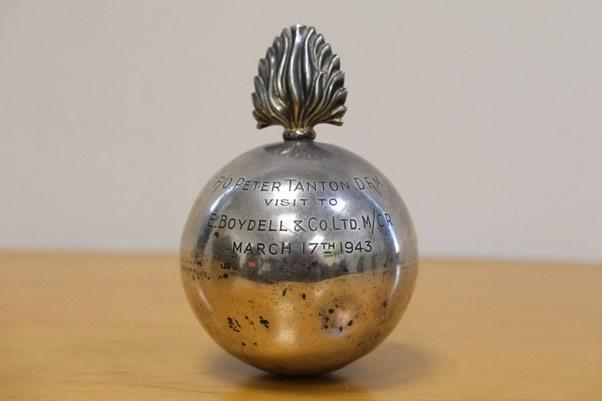 Silver ball commemorating Peter Tanton's  17 March 1943 visit to E. Boydell and Co. Ltd