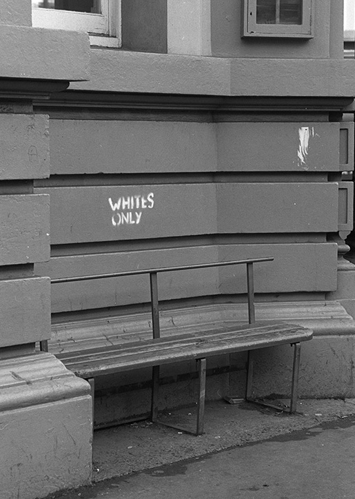 Wall with "WHITES ONLY" stenciled on it