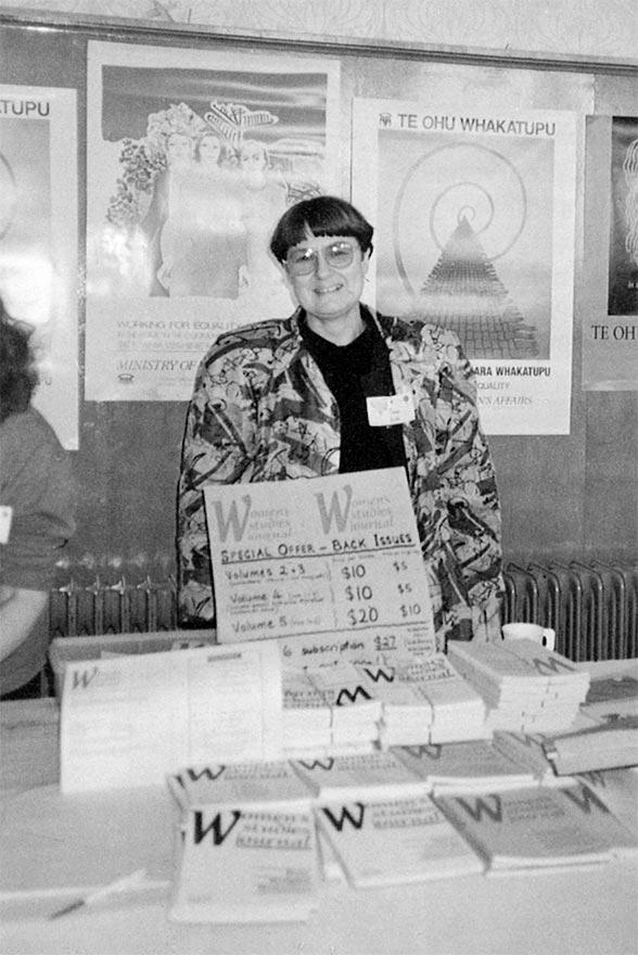 Anne Else behind a books stand selling WSA journals