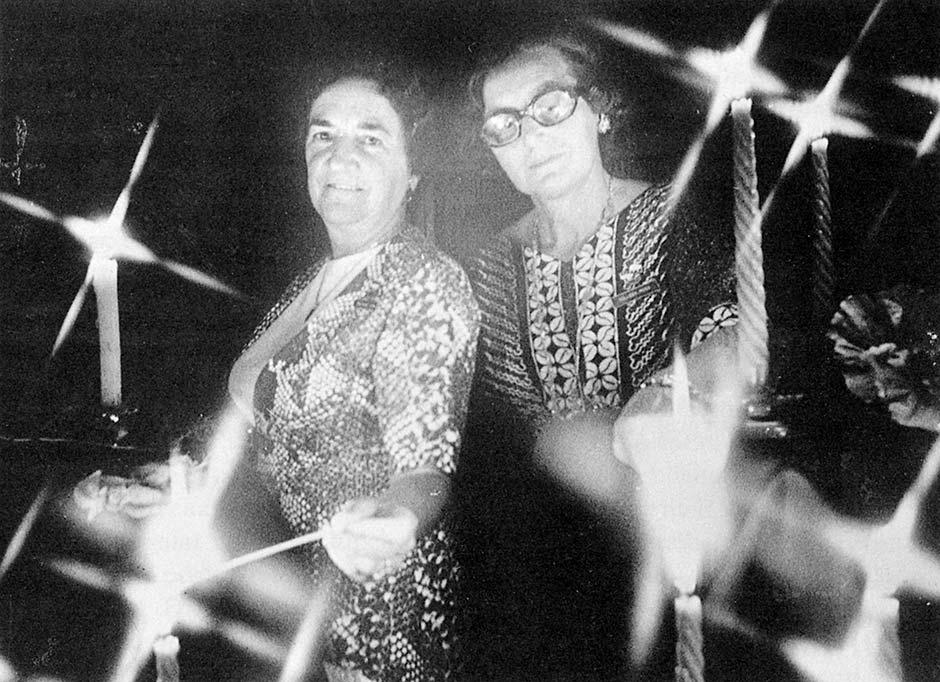 Two women with candles