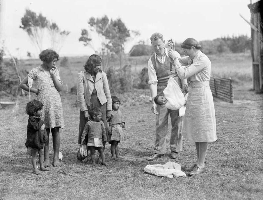 District nurse weighing baby, Waihara