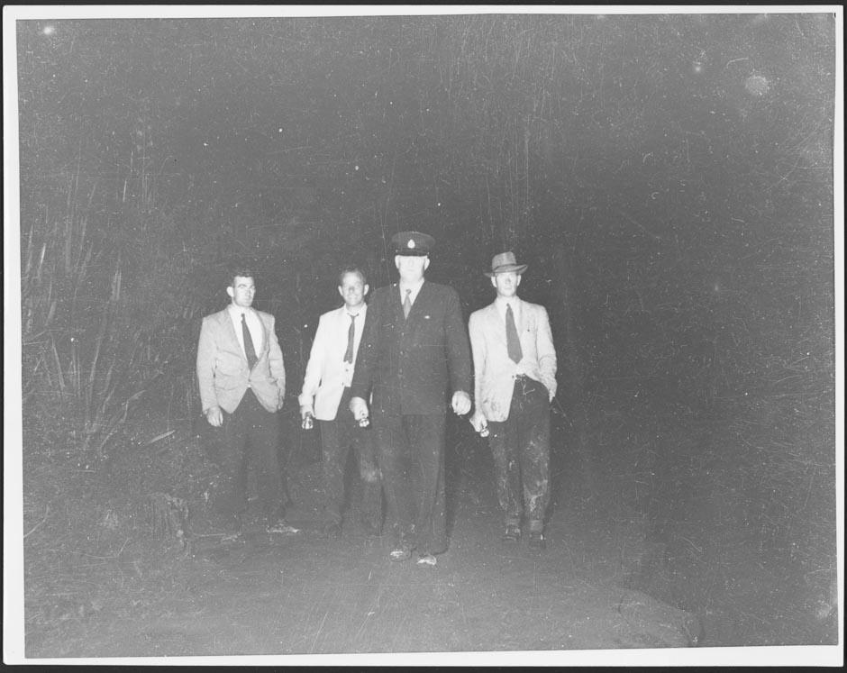 Police officer and search volunteers at Tangiwai